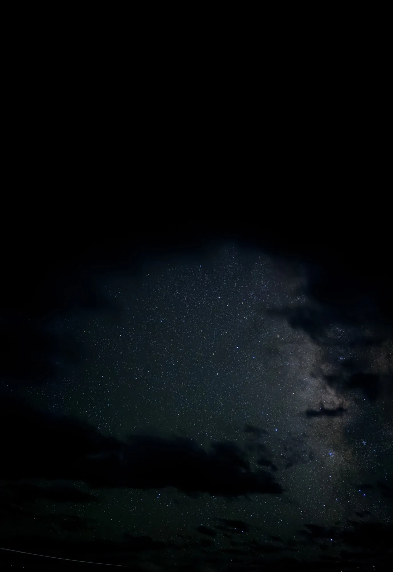 Milky Way core barely breaking through heavy cloud at Hanle on night one
