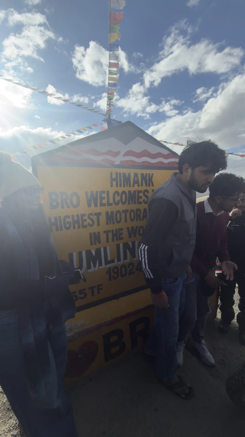 The Umling La marker, and the crowd in front of it
